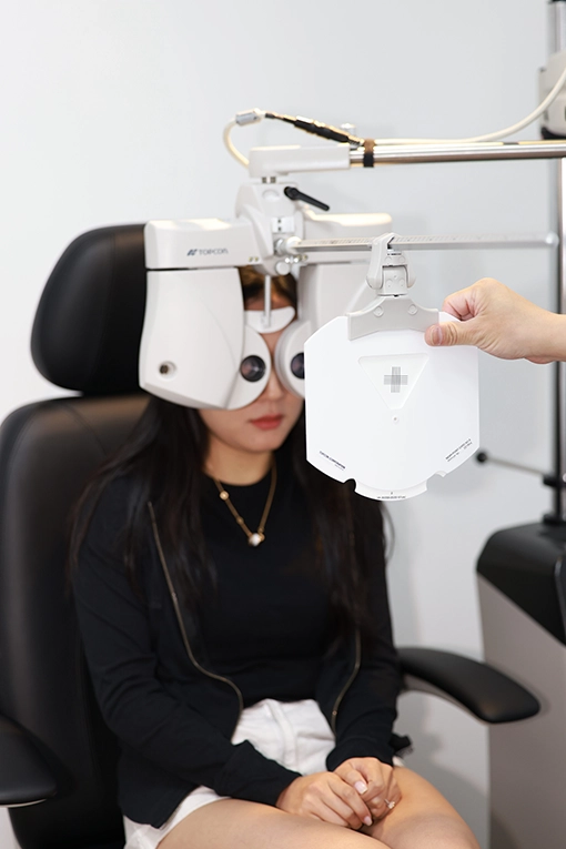 A patient receiving an eye exam.